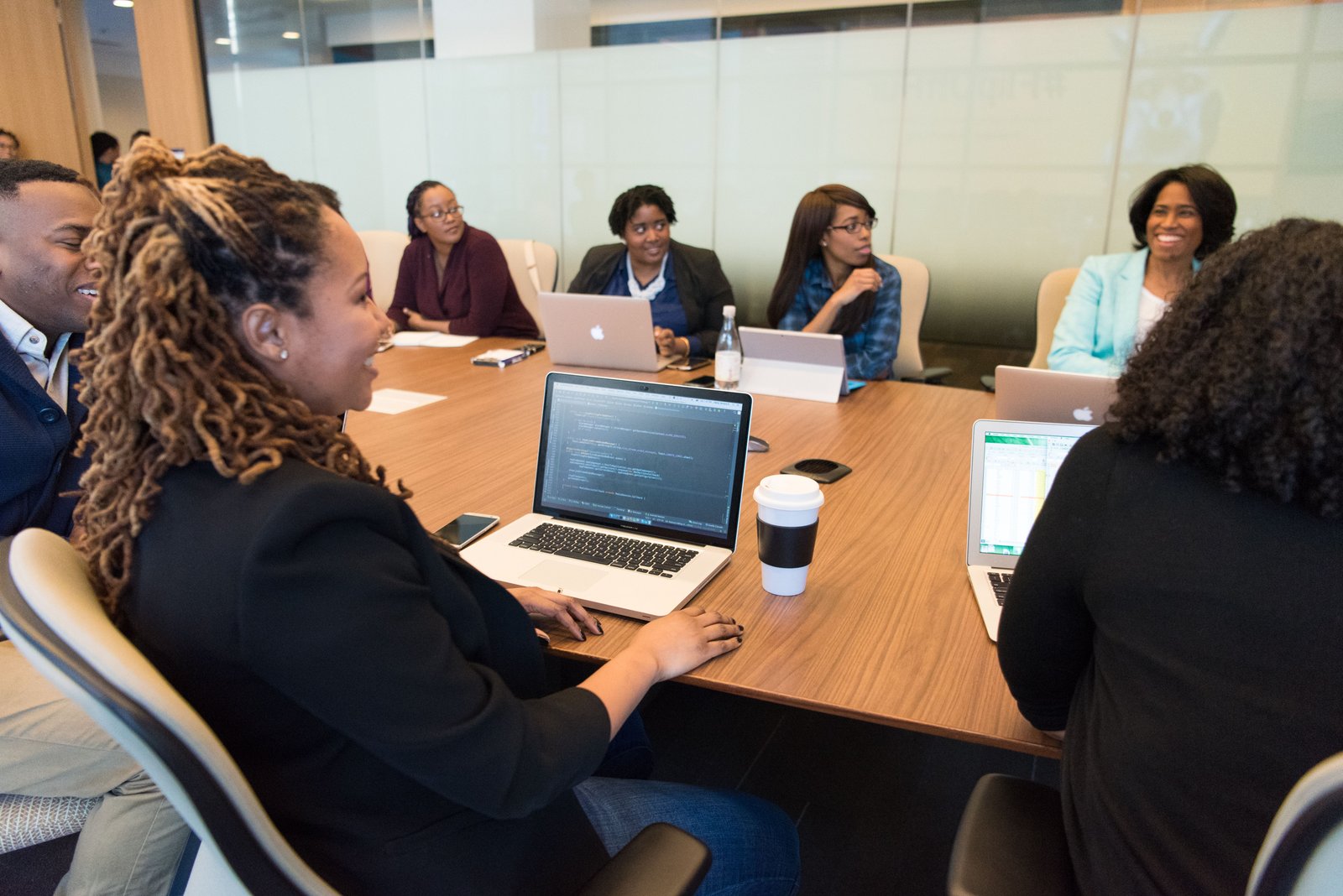 Professionals discussing business in a Lagos office